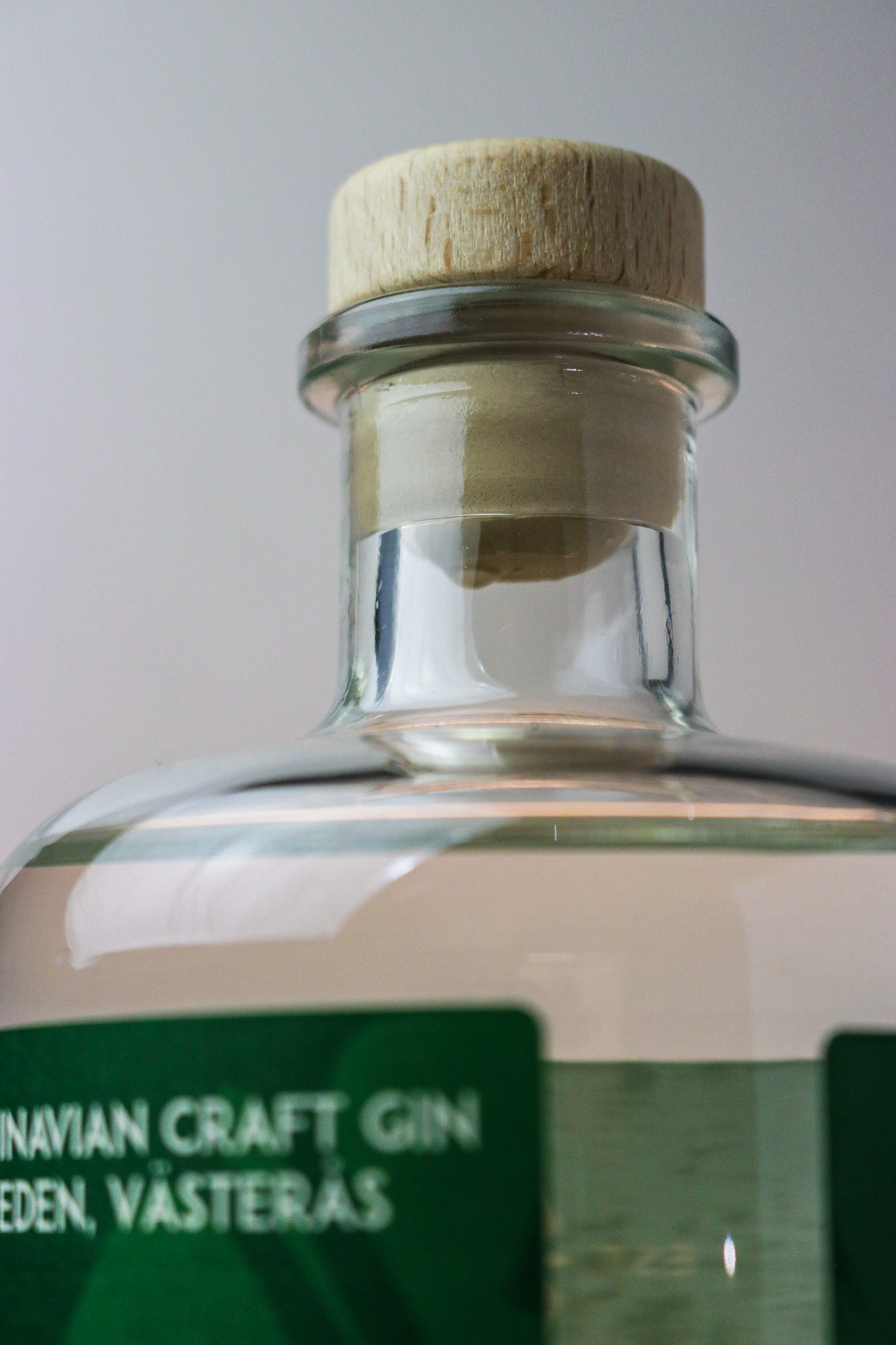 High angle view of a bottle of Västerås Destilleri gin on a wooden table